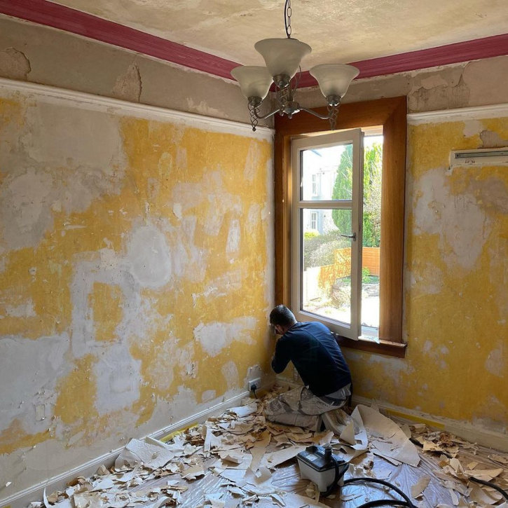 Wallpaper stripped back and walls prepared before decorating
